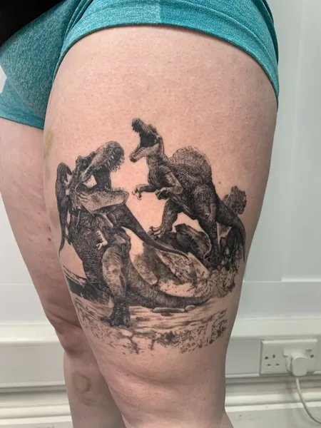 Fighting dinosaurs — black and grey realism tattoo by Lewis Zangaro, The SelfMade Tattoo Company, Wolverhampton