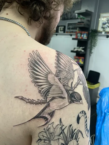 Flying swallow — black and grey realism tattoo by Lewis Zangaro, The SelfMade Tattoo Company, Wolverhampton