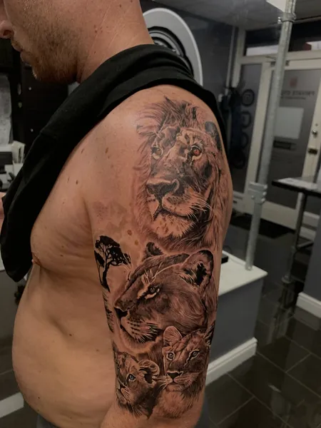 Lion family tattoo — black and grey realism tattoo by Lewis Zangaro, The SelfMade Tattoo Company, Wolverhampton