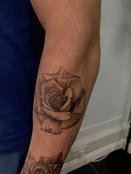Rose tattoo — black and grey realism tattoo by Lewis Zangaro, The SelfMade Tattoo Company, Wolverhampton