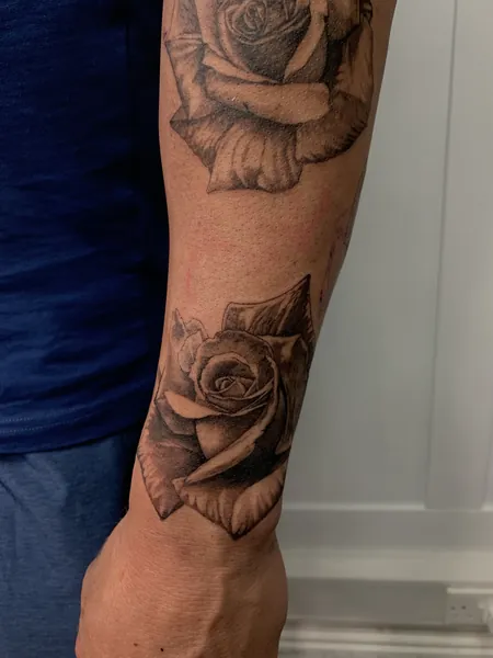 Two roses — black and grey realism tattoo by Lewis Zangaro, The SelfMade Tattoo Company, Wolverhampton