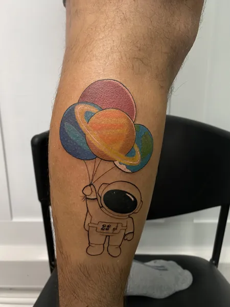 Astronaut holding planet balloons — colour tattoo by Lewis Zangaro, The SelfMade Tattoo Company, Wolverhampton